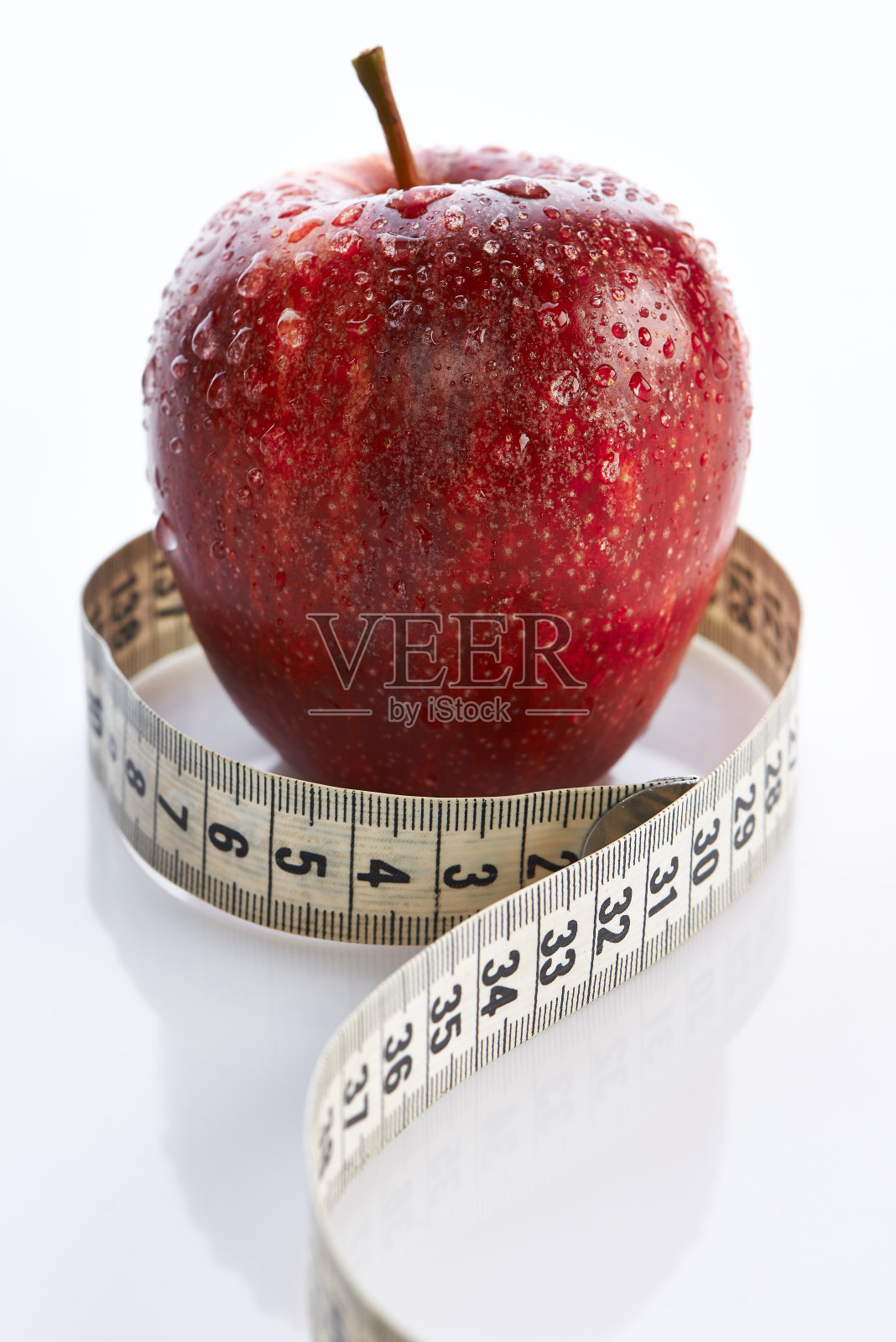红苹果和卷尺照片摄影图片