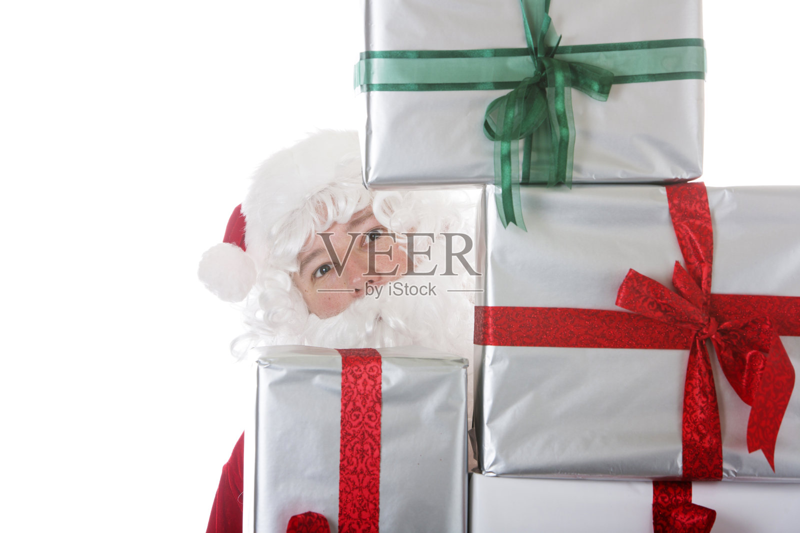 带着一堆礼物的圣诞老人照片摄影图片