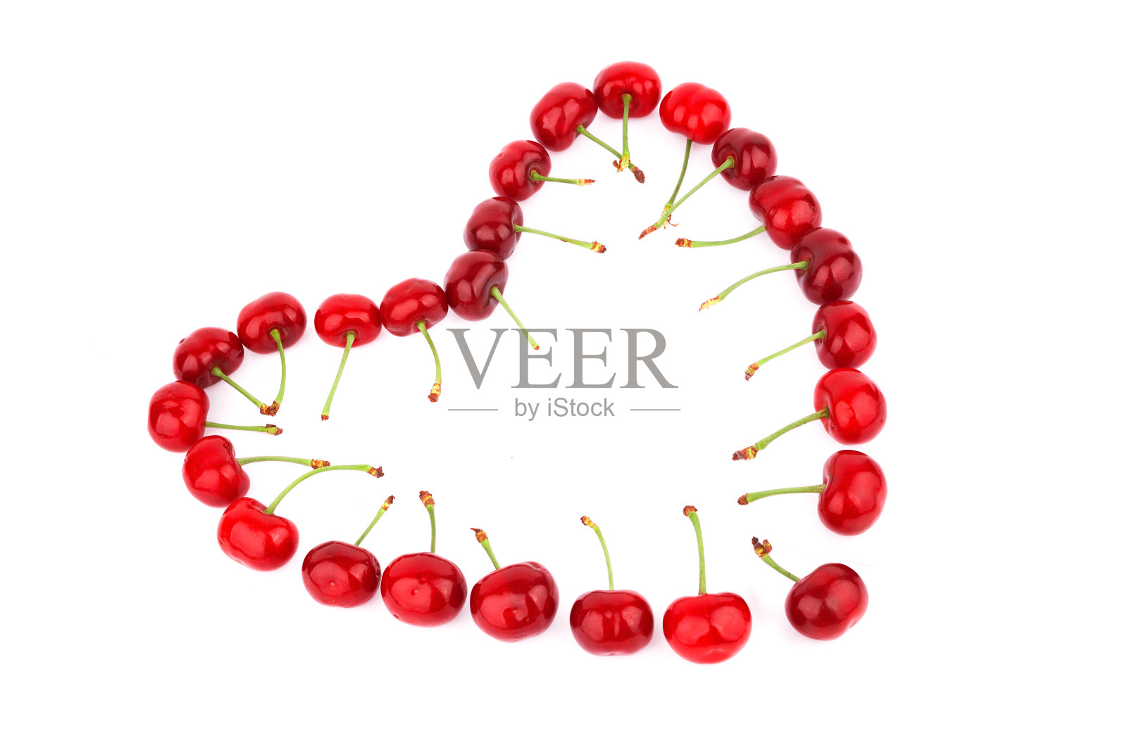 心形的红樱桃，孤立在白色背景上照片摄影图片