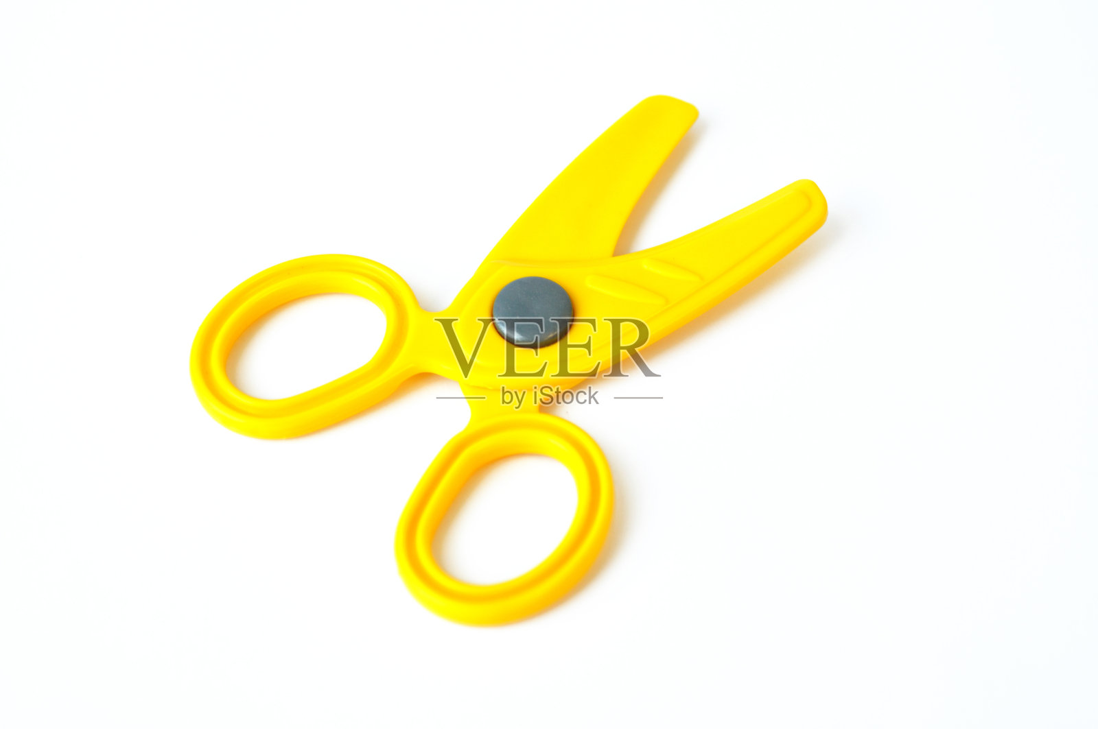 黄色的玩具剪刀照片摄影图片