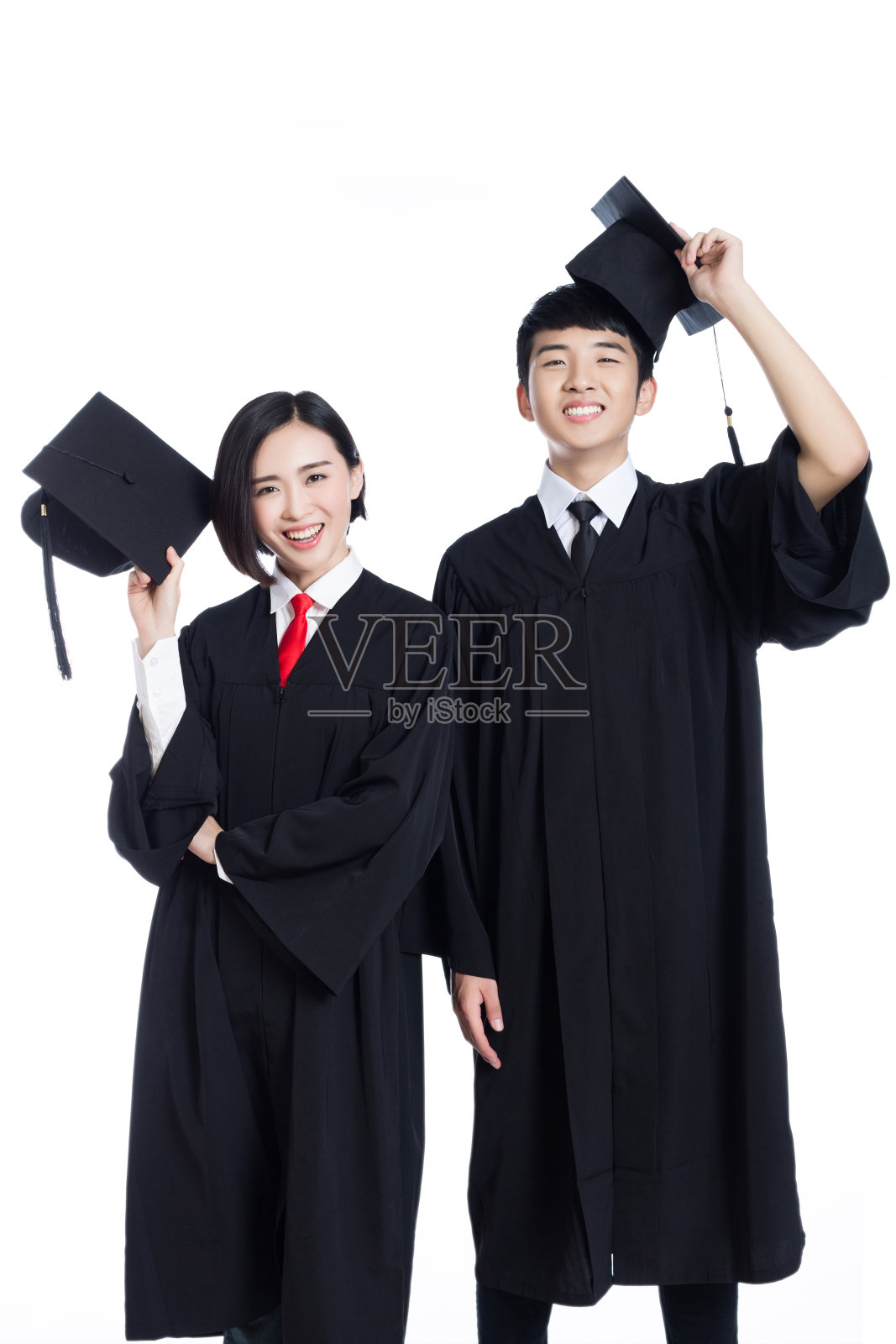 两个快乐的毕业生孤立在白色照片摄影图片