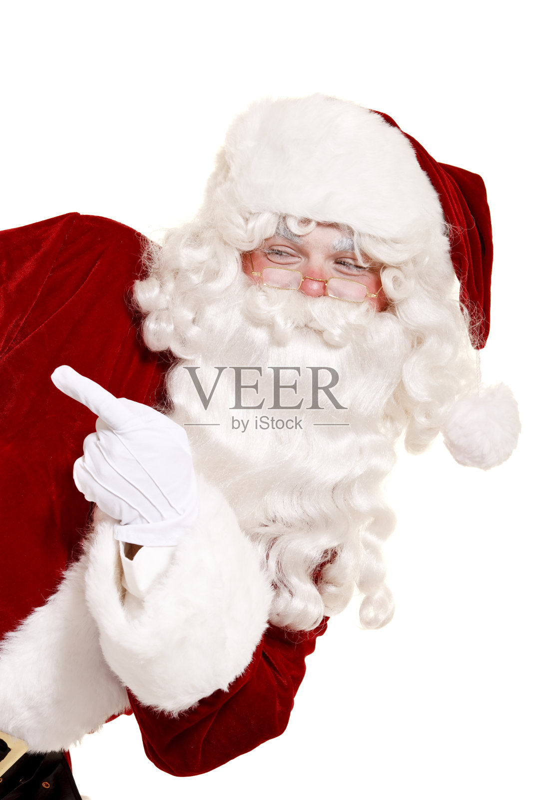 圣诞老人指着孤立的白色照片摄影图片