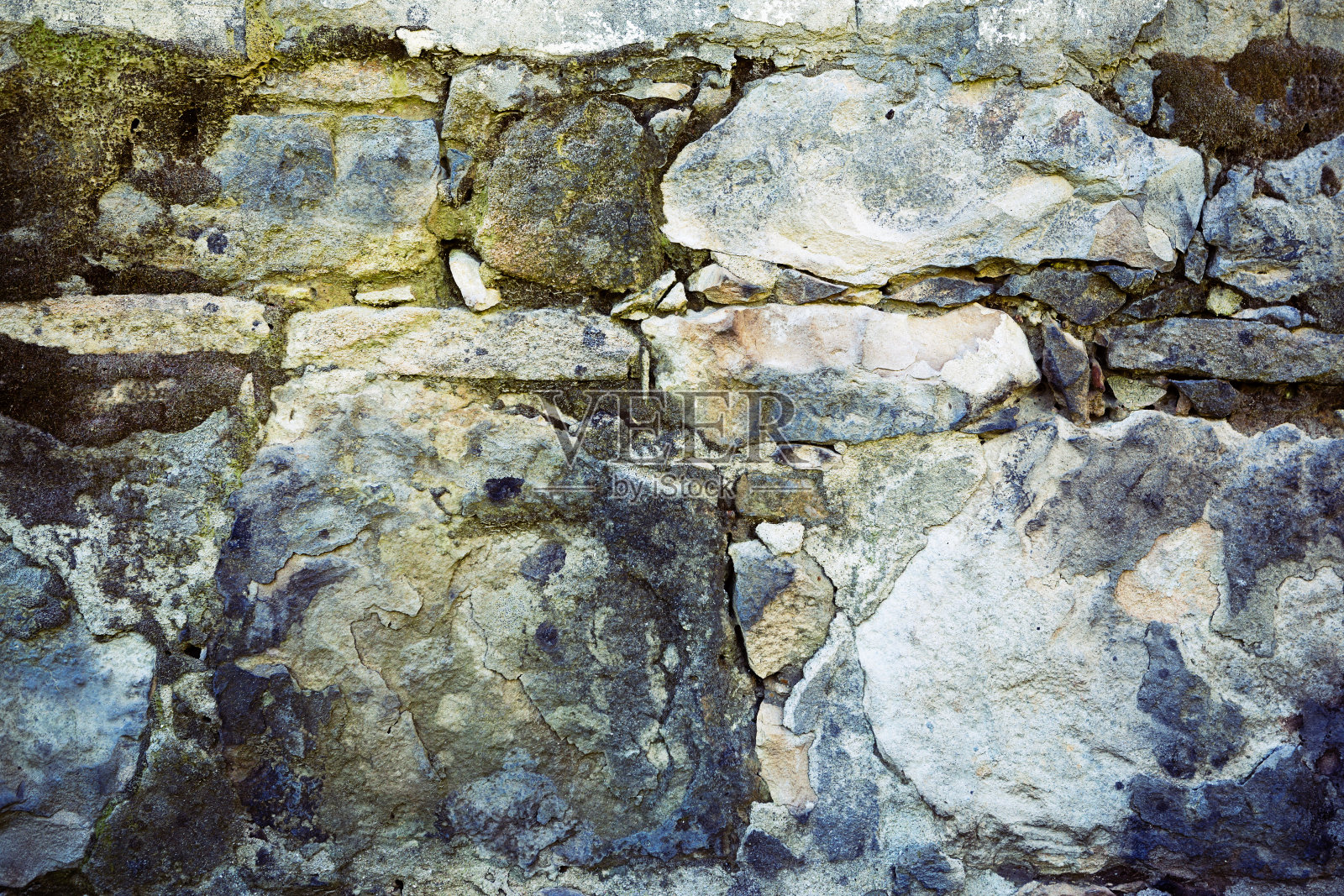 背景:纹理古老的手工建造的石墙照片摄影图片