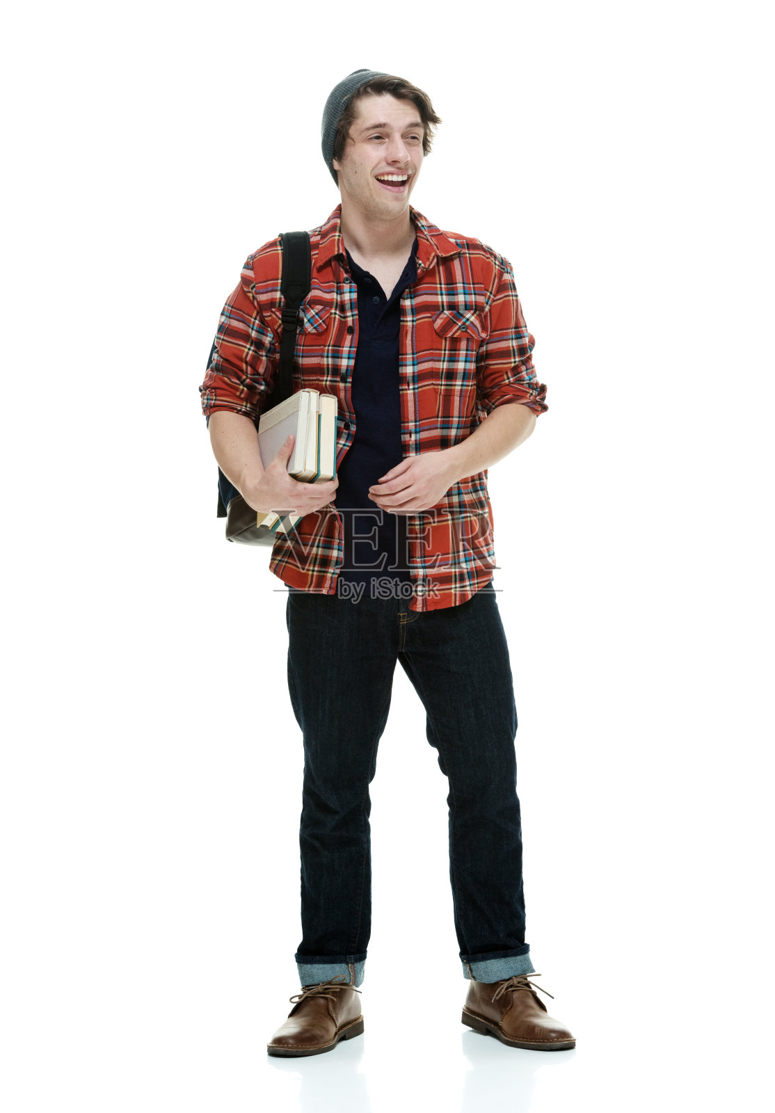 微笑的学生拿着书照片摄影图片