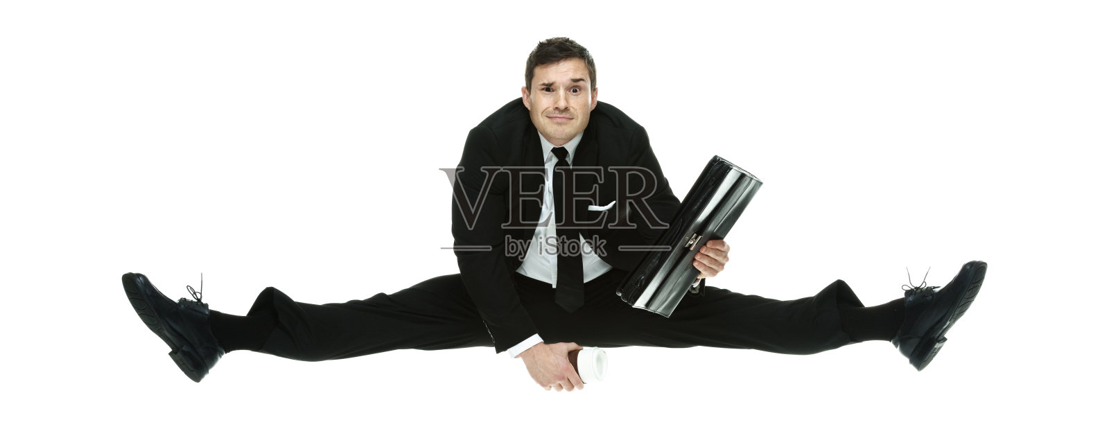 商人拿着公文包跳了起来照片摄影图片