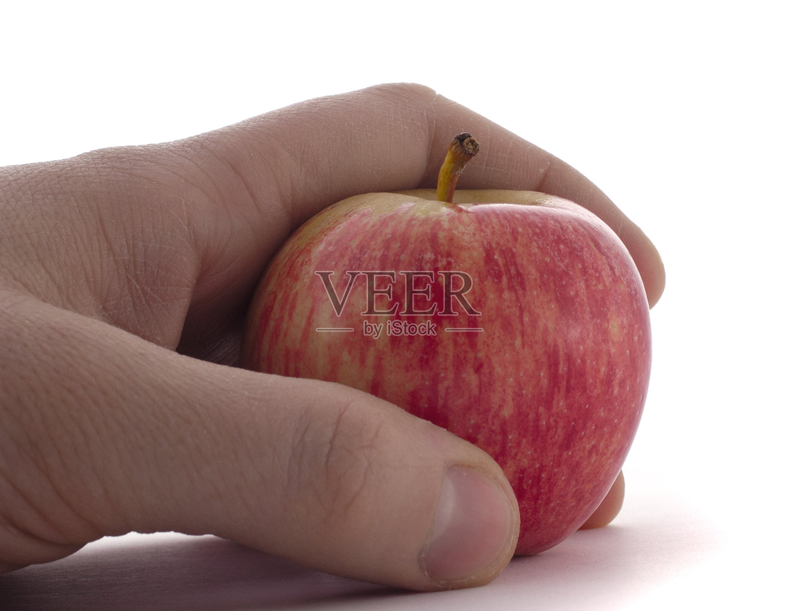 健康饮食:男性手拿一个苹果孤立照片摄影图片