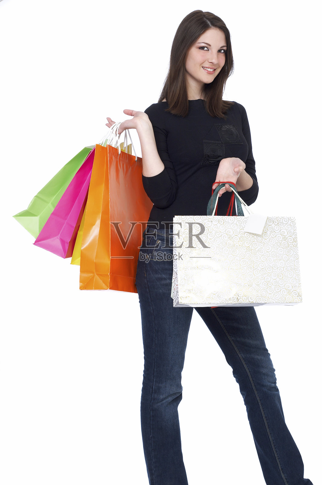 年轻女子拿着购物袋孤立在白色背景照片摄影图片