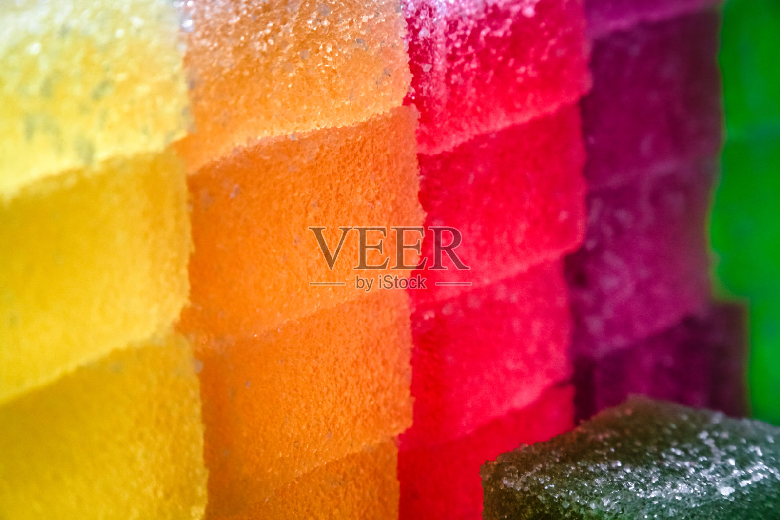 墙上的糖衣彩色果冻水果糖果接近照片摄影图片