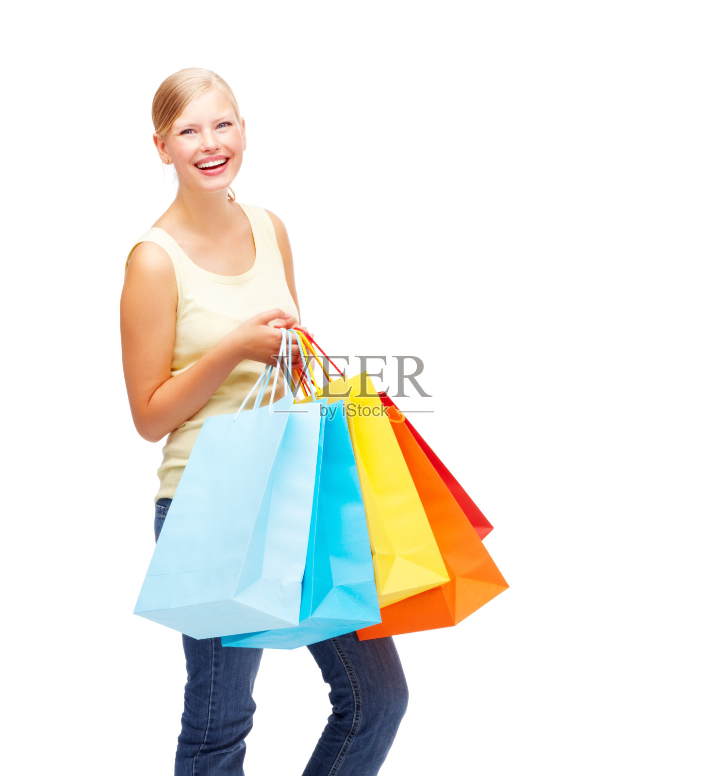 穿着白色购物袋微笑的漂亮女人照片摄影图片