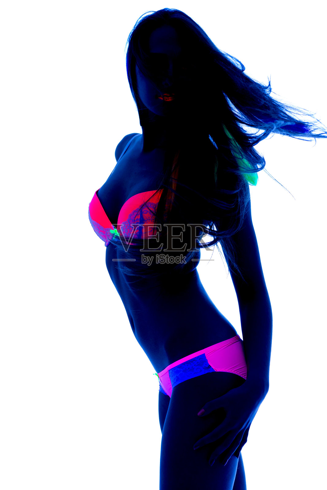 黑光下的性感舞者照片摄影图片