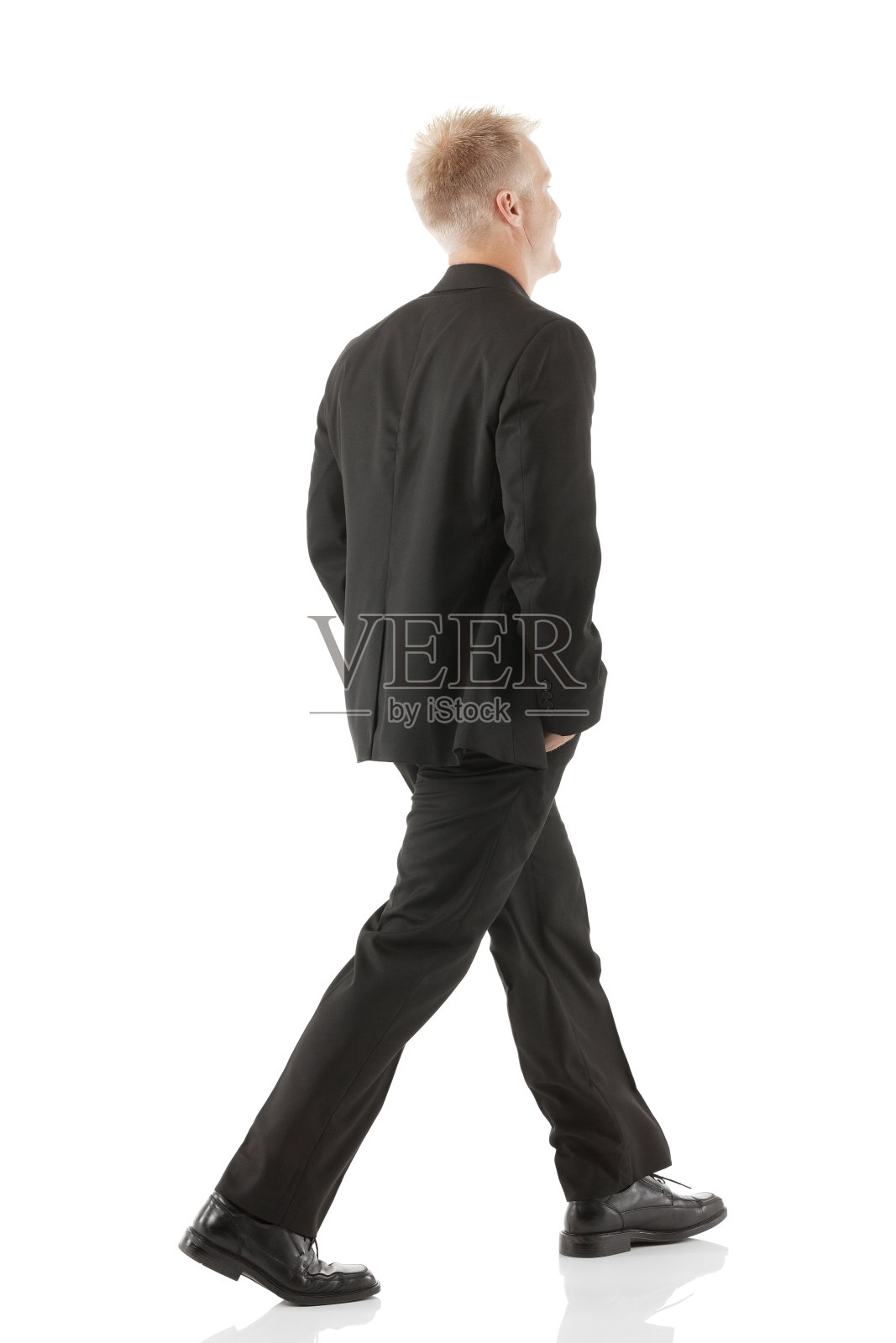 一个商人走路的侧面照片摄影图片
