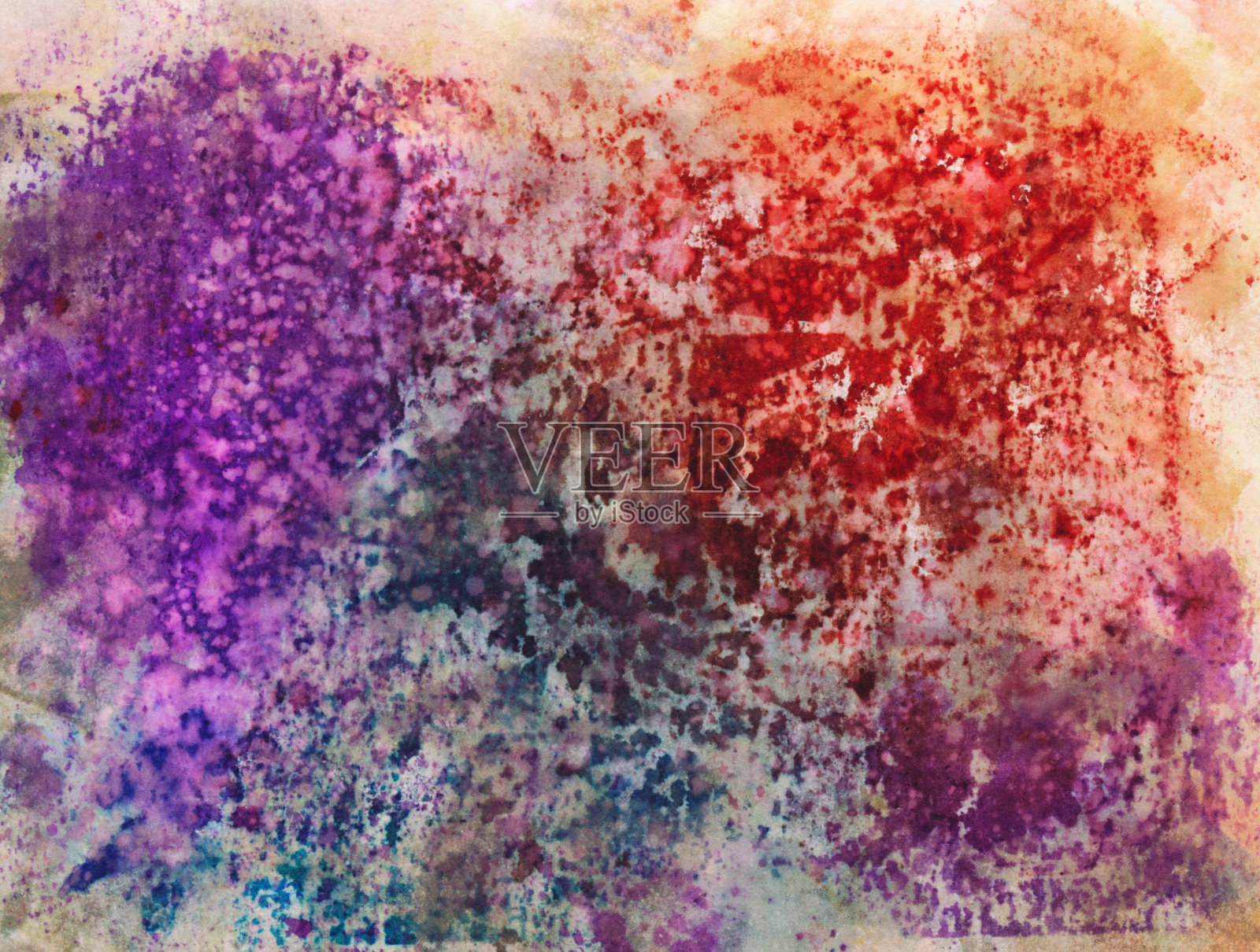 彩色的颜料飞溅纹理在水彩纸上照片摄影图片