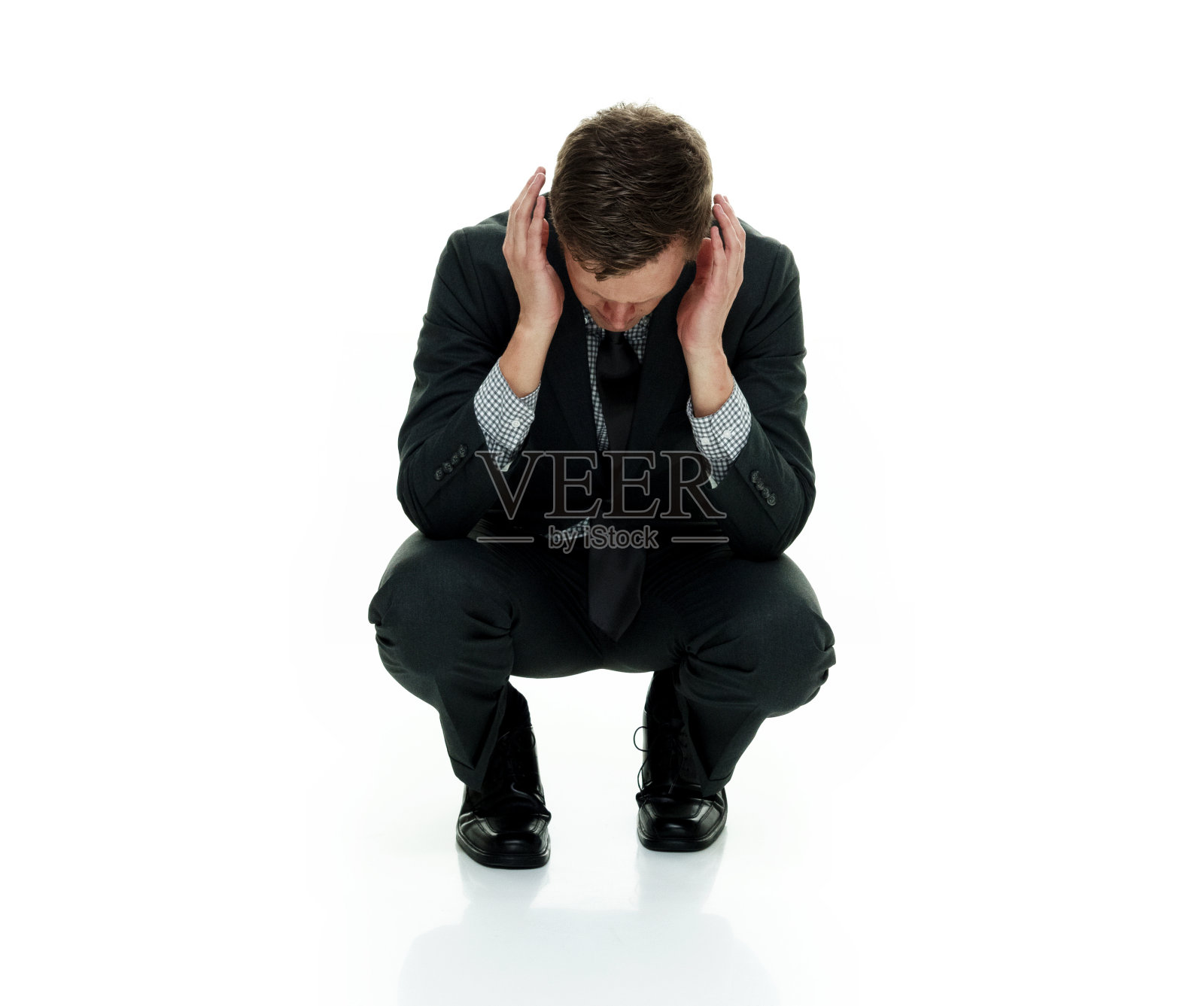 商人捂住耳朵照片摄影图片