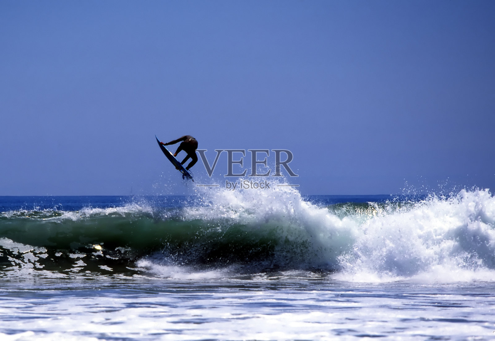 冲浪者捕捉空气照片摄影图片