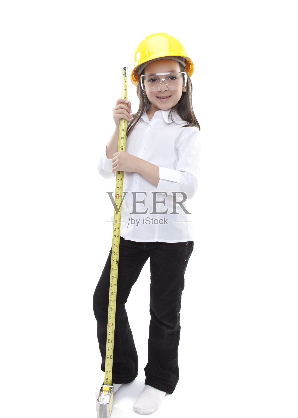 年轻的白人女孩与安全帽和卷尺照片摄影图片