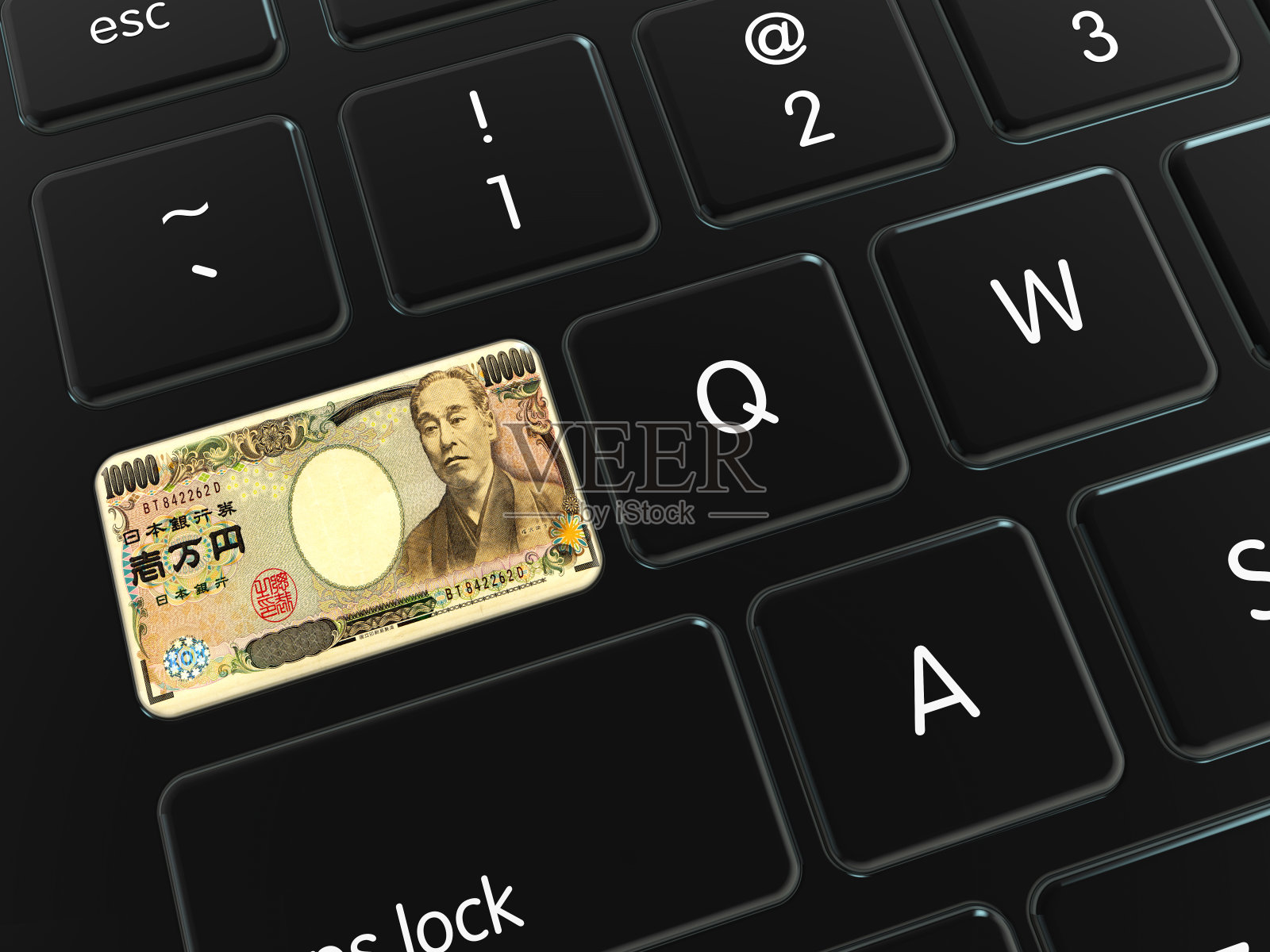 电脑键盘上的日元钞票照片摄影图片