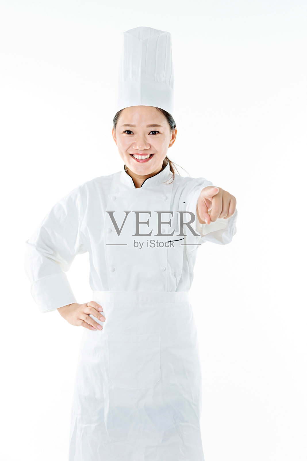 年轻女厨师在指指点点照片摄影图片