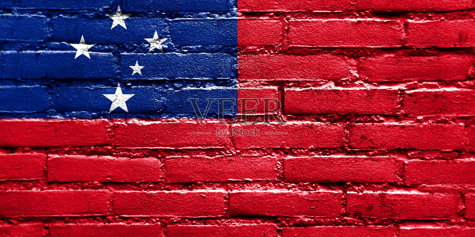 砖墙上画着萨摩亚国旗照片摄影图片