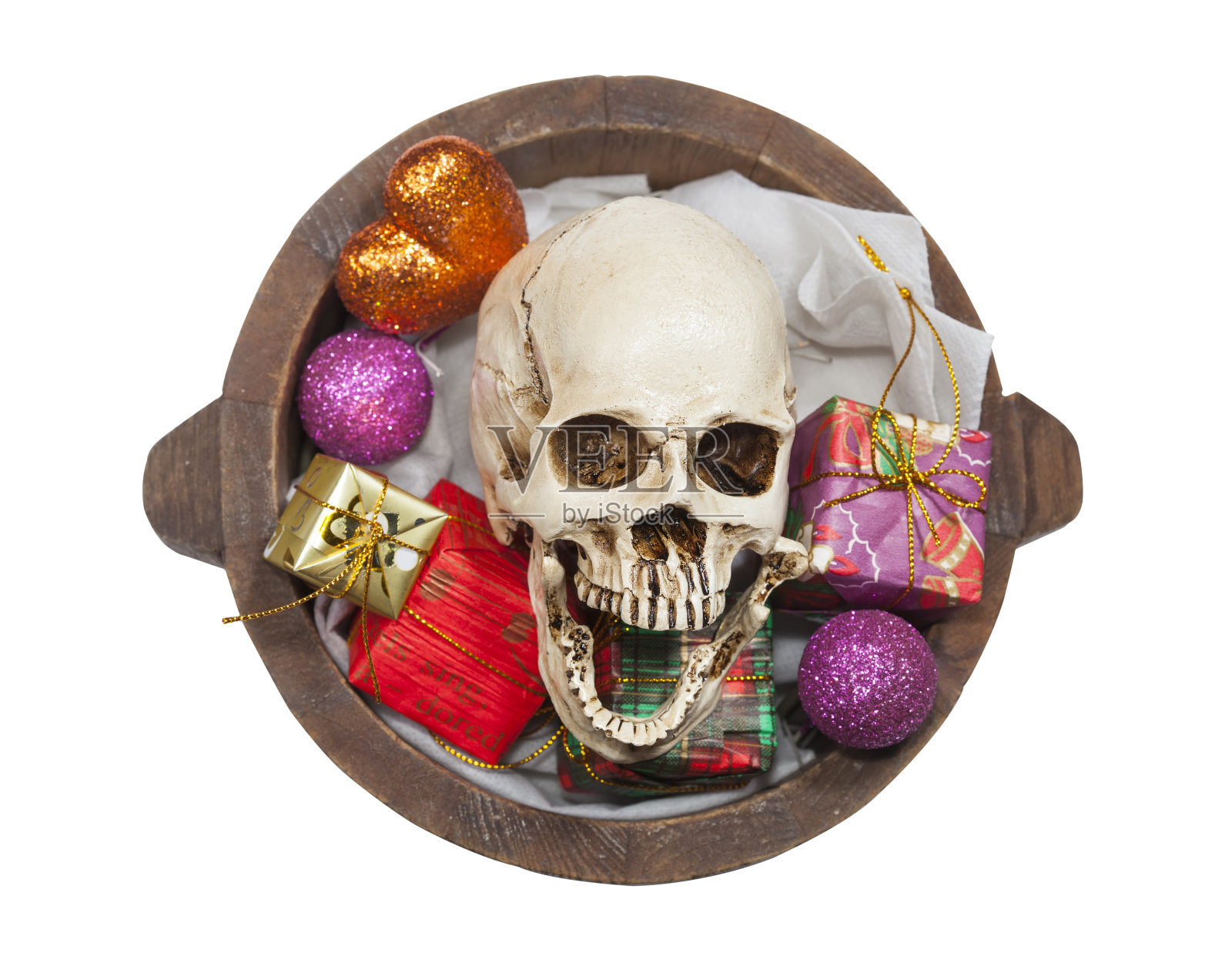 骷髅在礼物桶里，万圣节的喜庆照片摄影图片