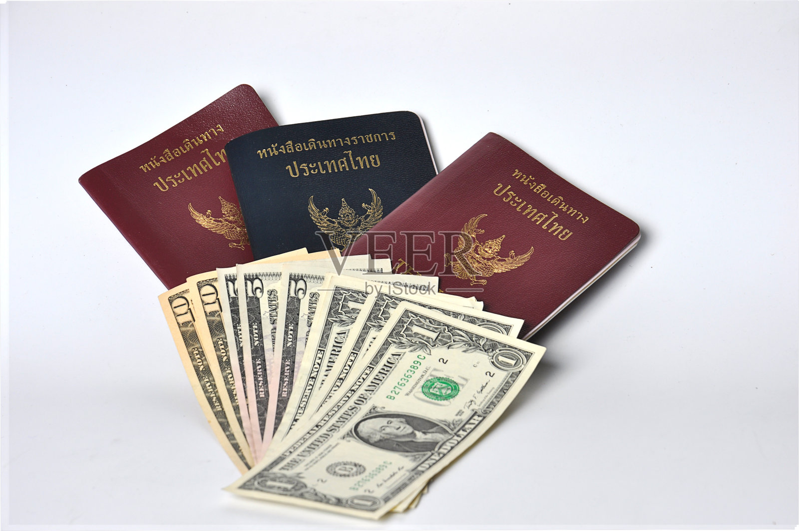 泰国护照和美元照片摄影图片
