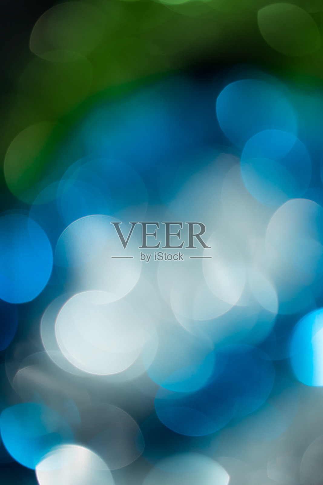 抽象背景的一个美丽的蓝色和绿色节日散景照片摄影图片