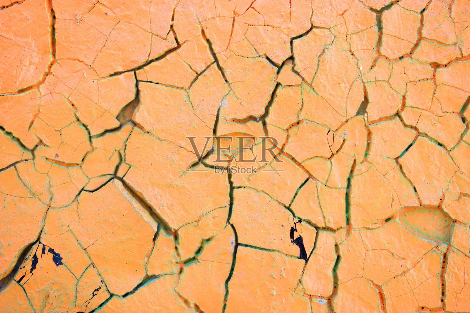 墙上开裂油漆的特写细节。照片摄影图片