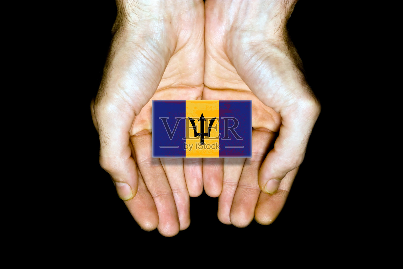 黑色背景上的巴巴多斯国旗照片摄影图片