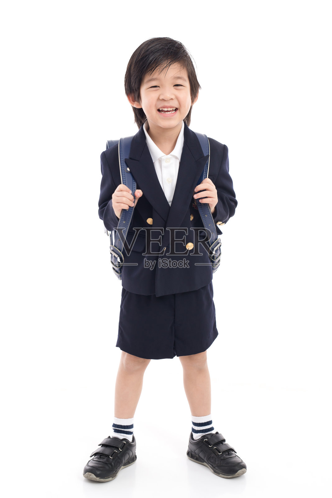 亚洲儿童校服和蓝色书包照片摄影图片