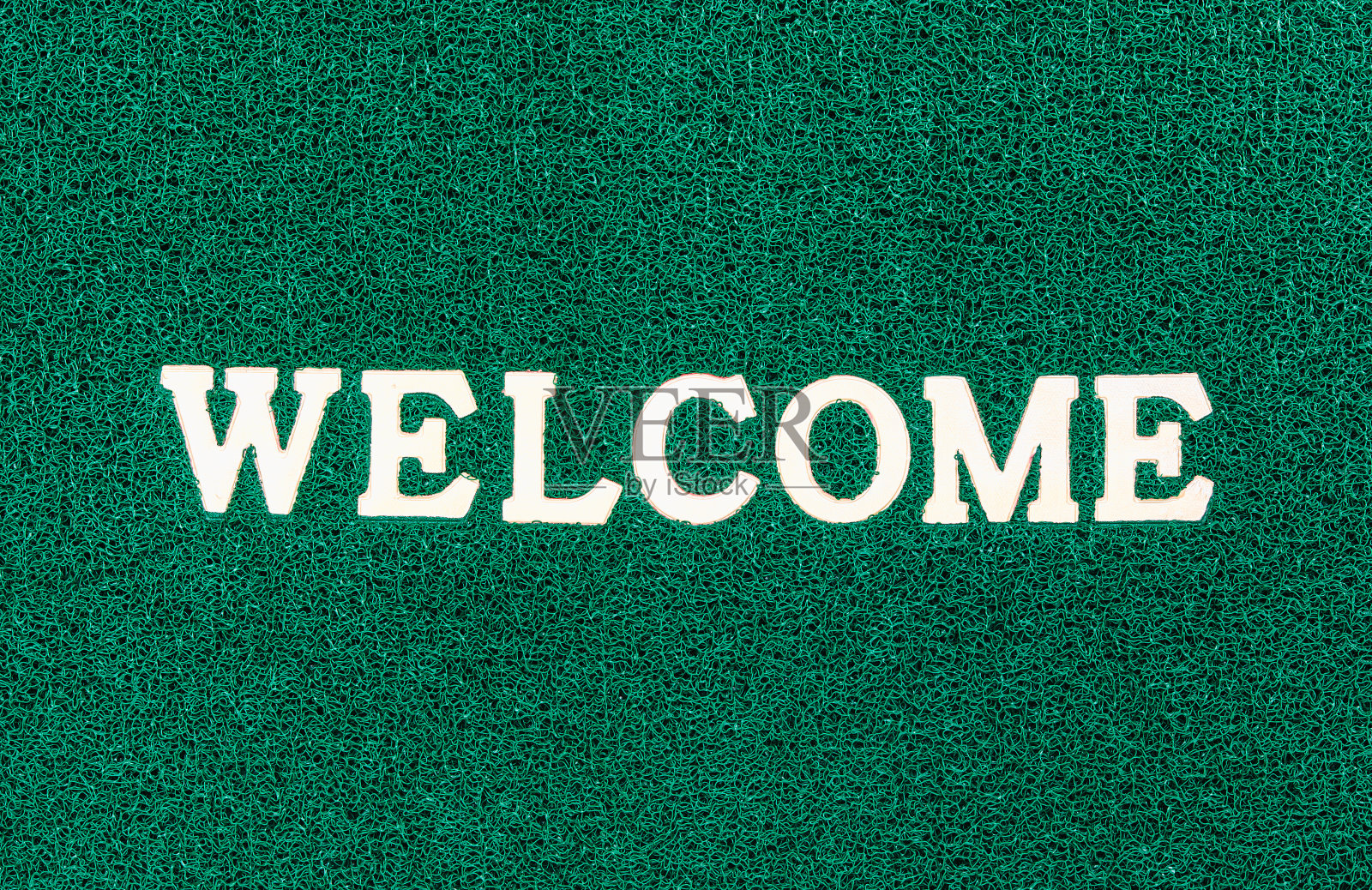 绿色门垫和欢迎短信照片摄影图片