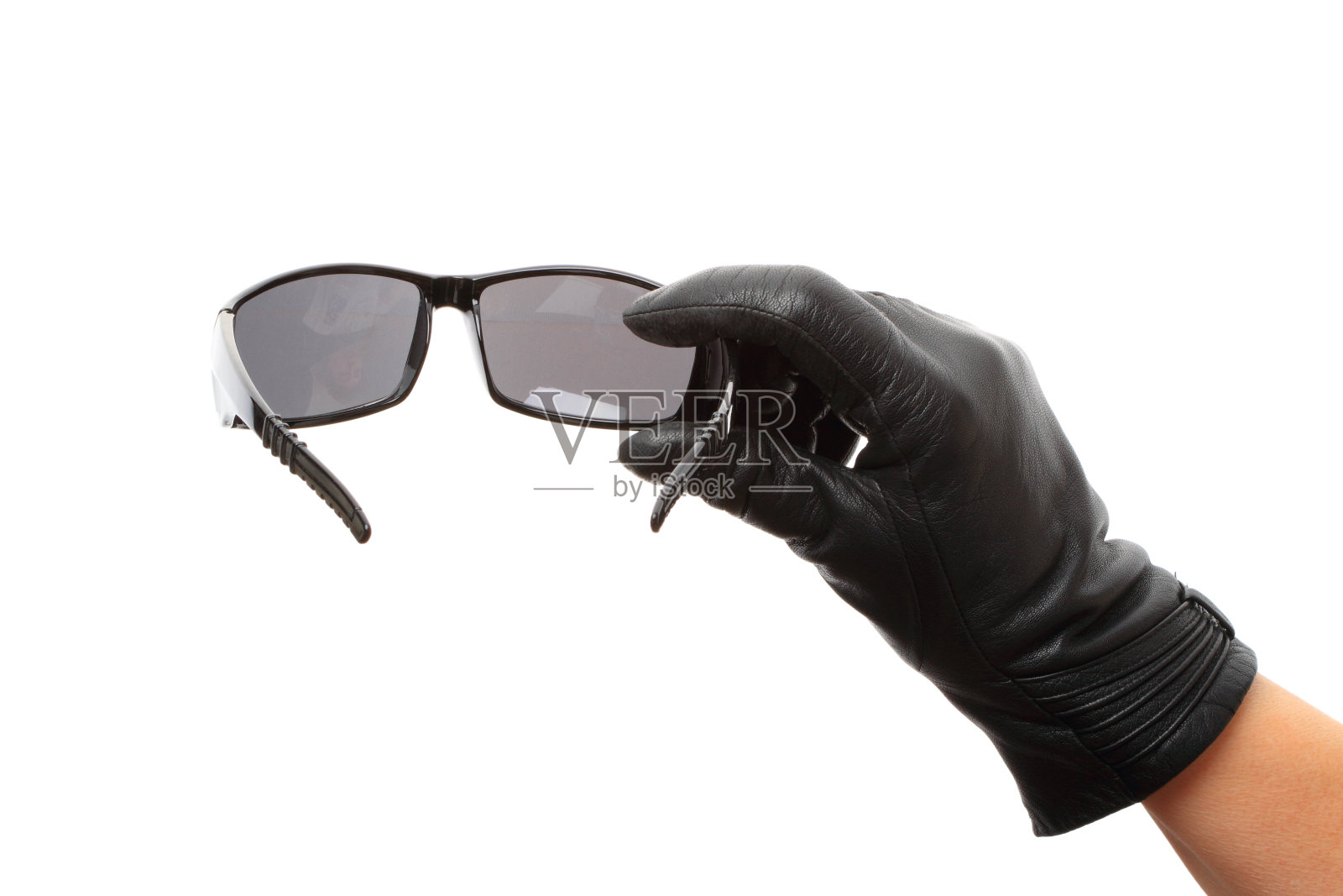 手戴黑色太阳镜照片摄影图片