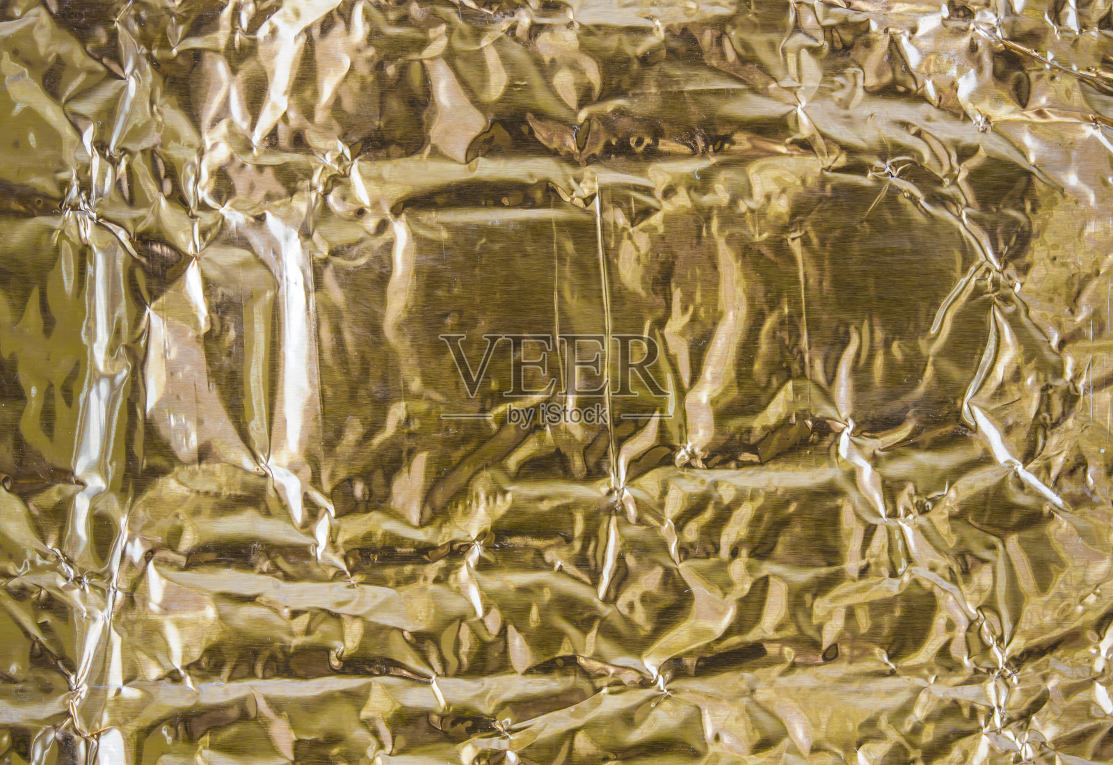 折痕和折叠的金纸提供一个纹理背景照片摄影图片