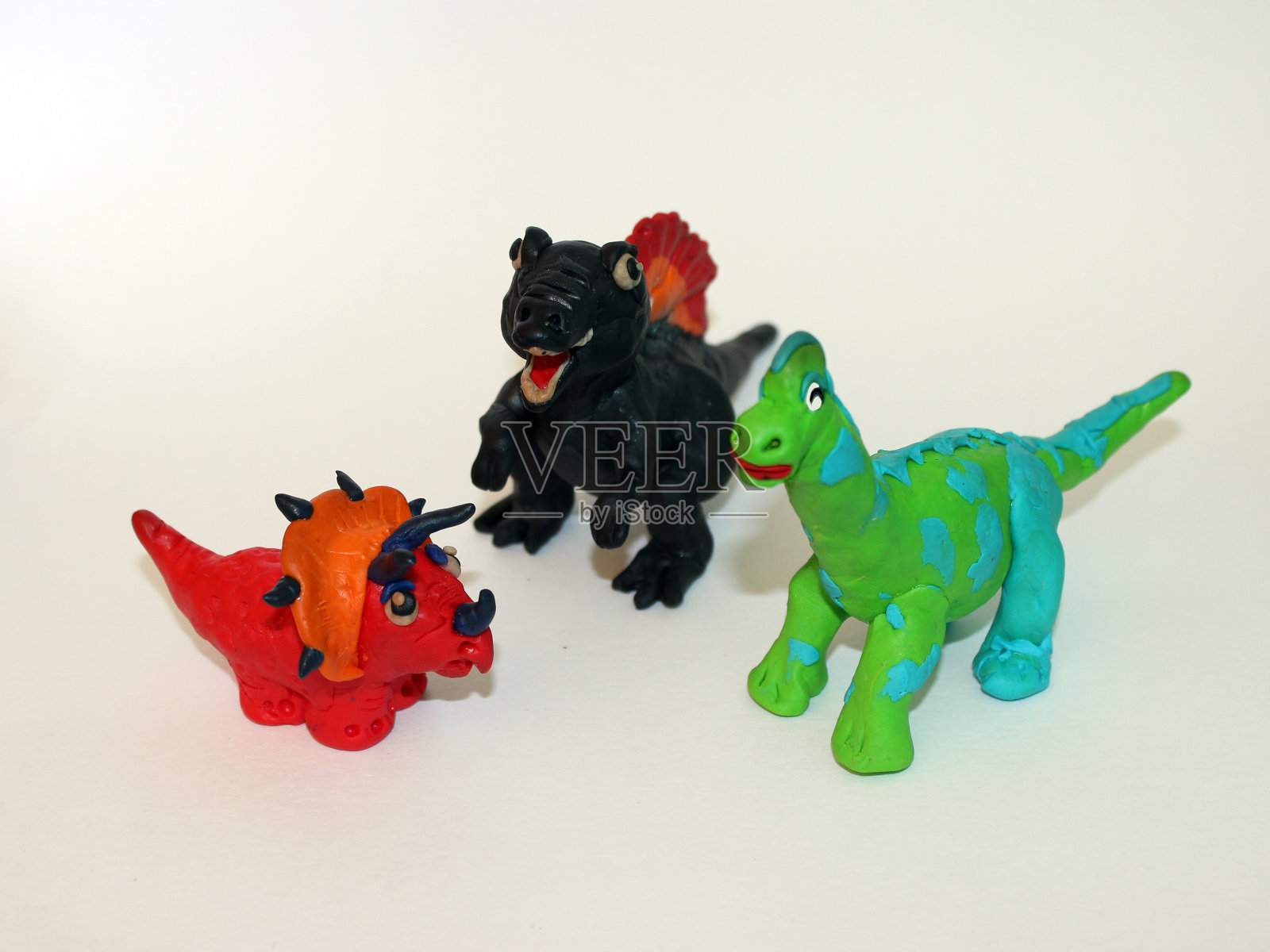 橡皮泥恐龙3D雕塑在白色的背景照片摄影图片