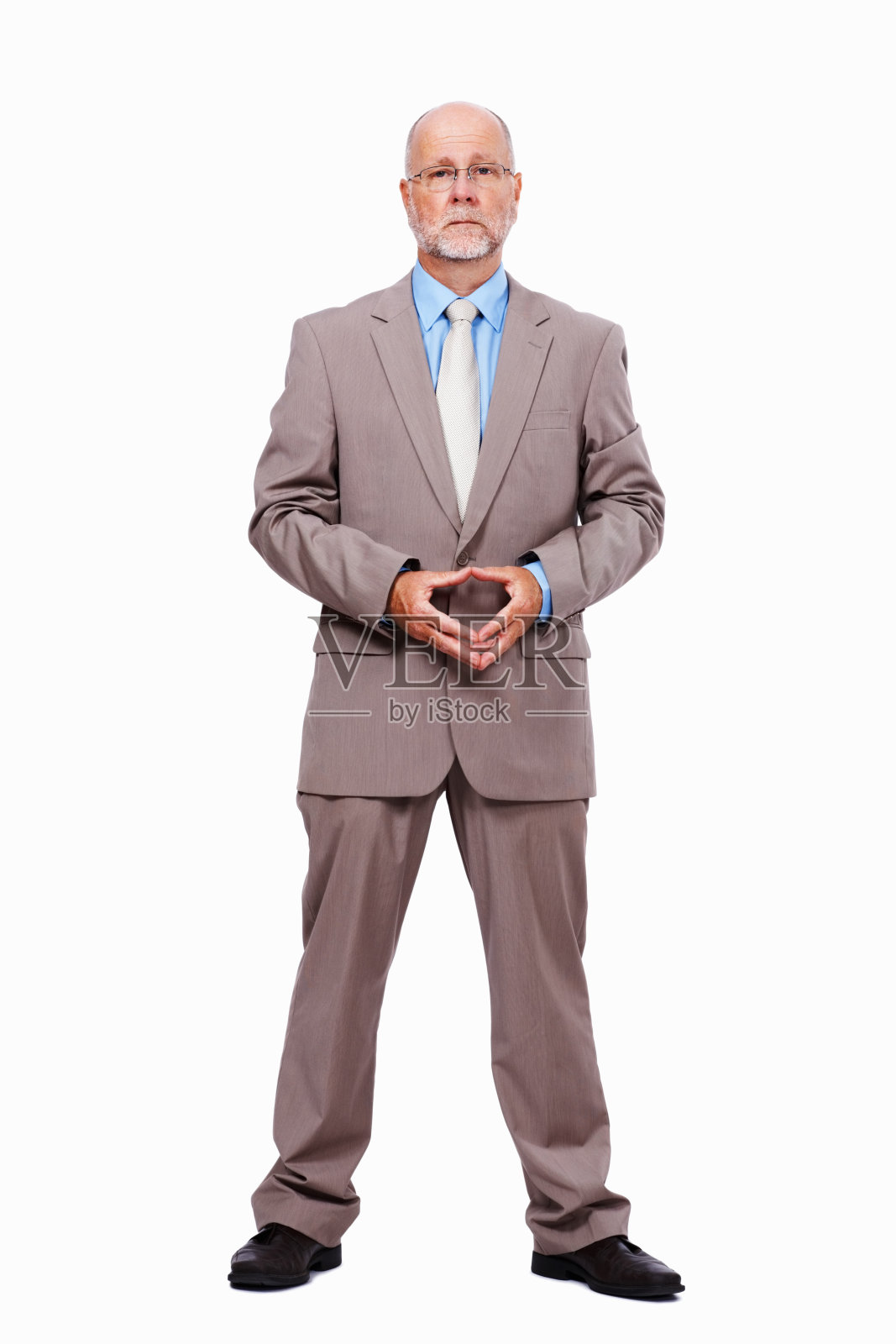 手指交叉站立的商人照片摄影图片