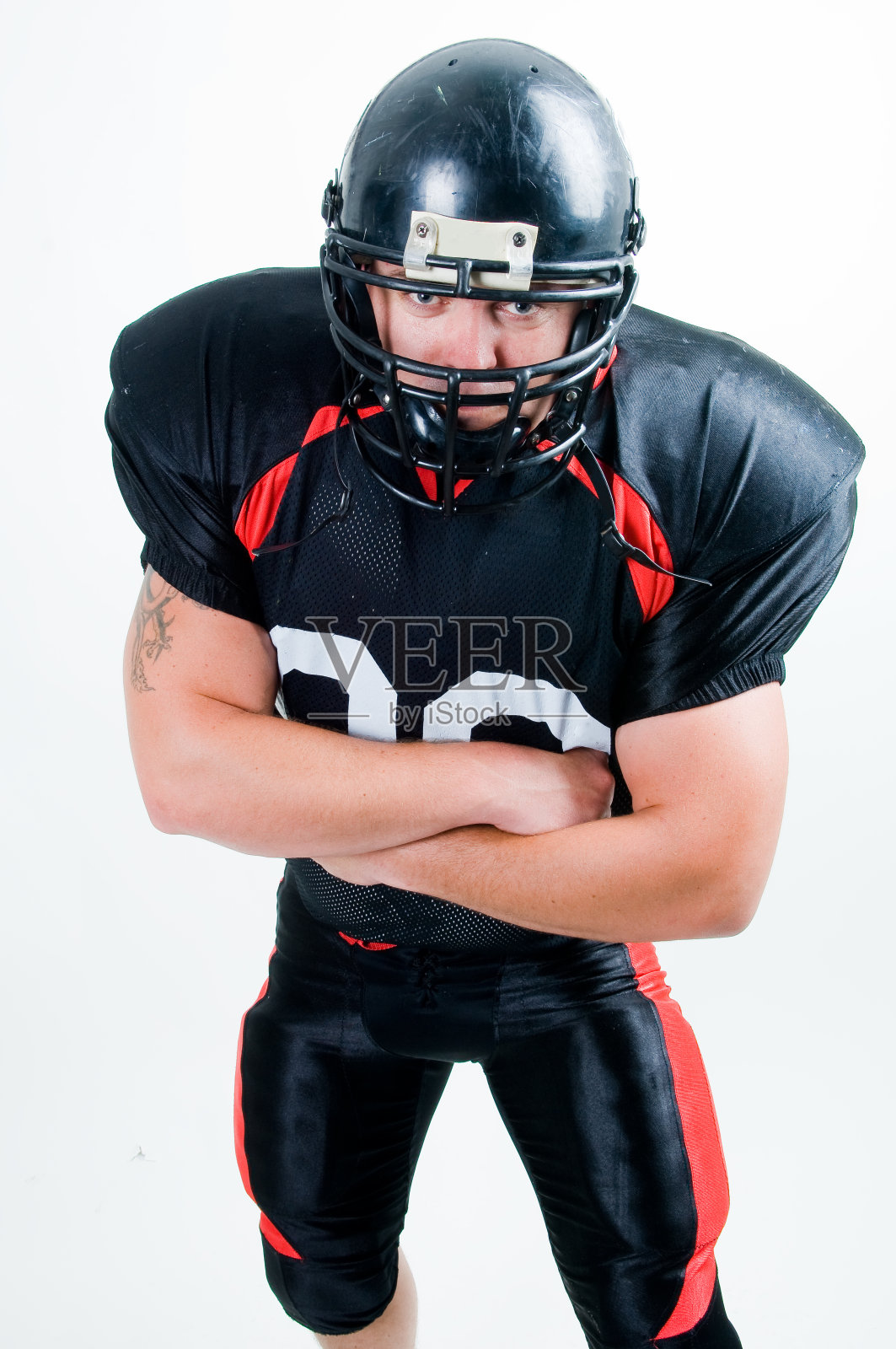 戴头盔的美国橄榄球运动员照片摄影图片