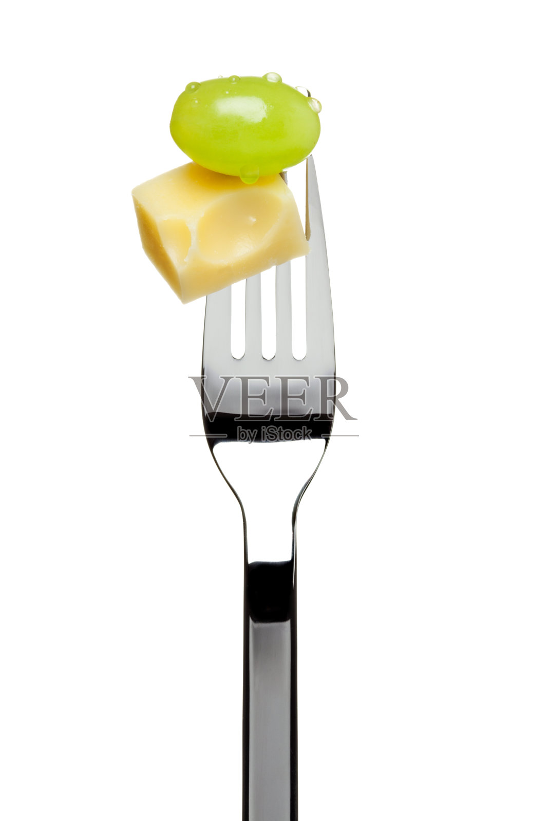 叉子上夹着瑞士奶酪和葡萄照片摄影图片