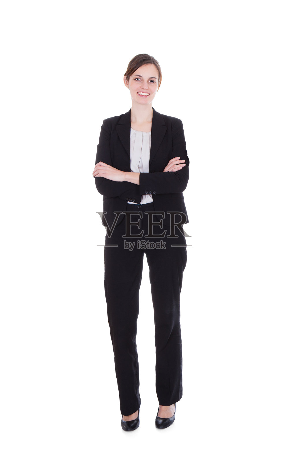 幸福的年轻女商人双臂交叉站着照片摄影图片