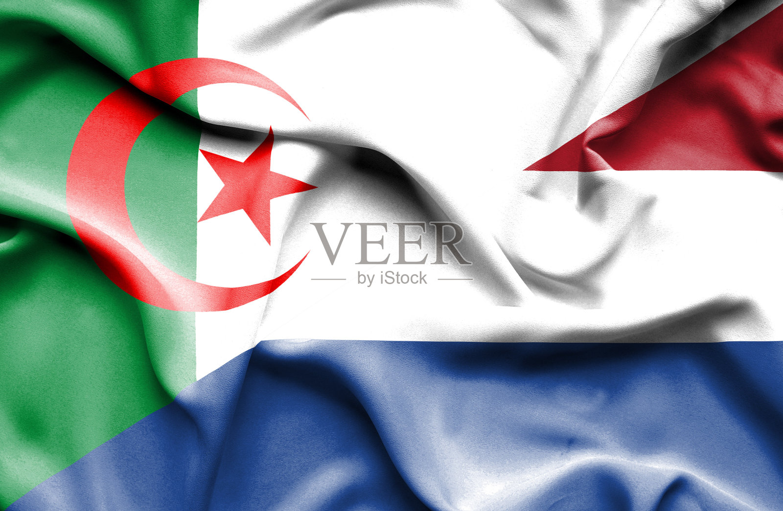 挥舞着荷兰和阿尔及利亚的旗帜照片摄影图片