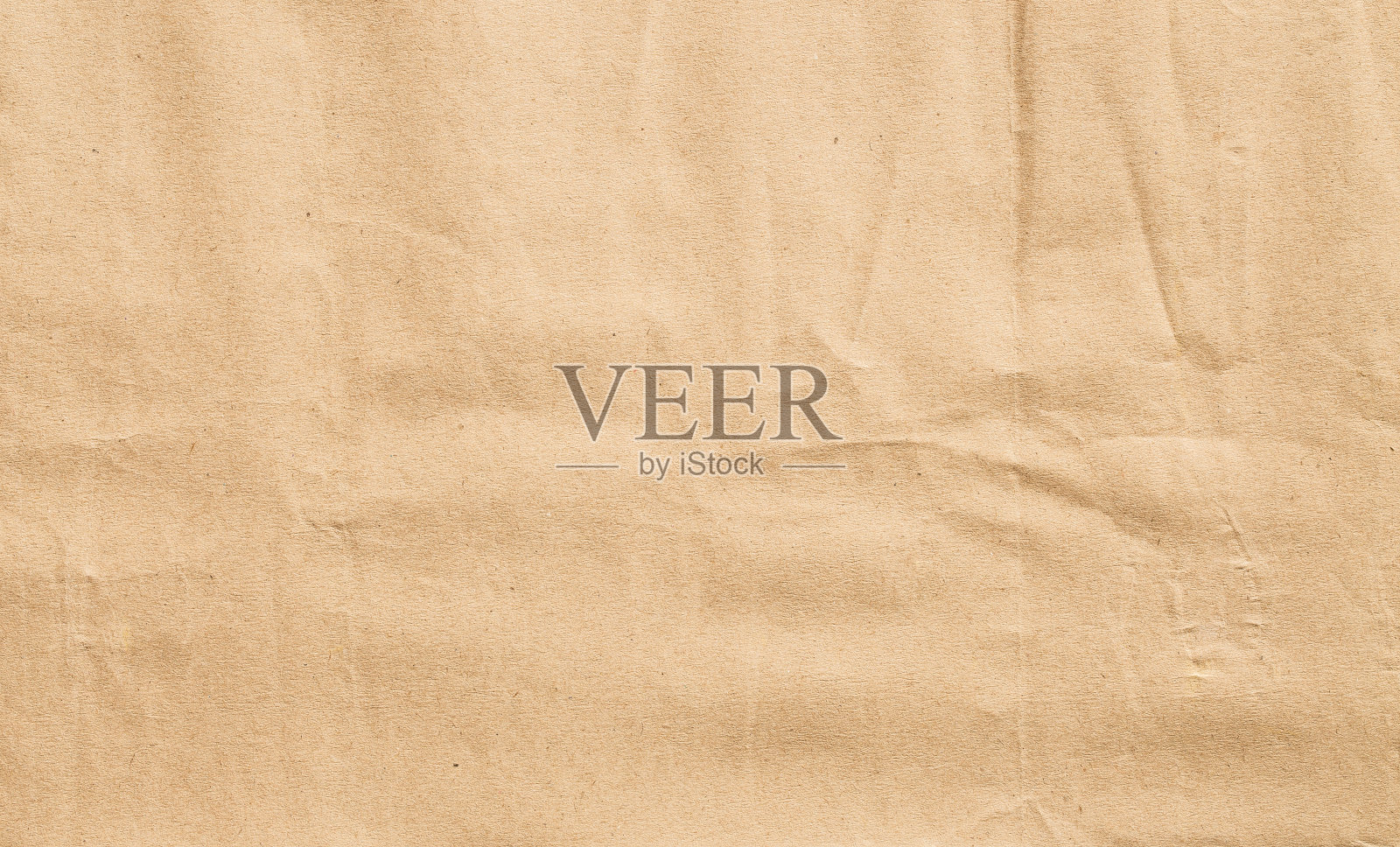 摘要以棕色折皱纸为背景，以棕色折皱纸为纹理进行设计照片摄影图片