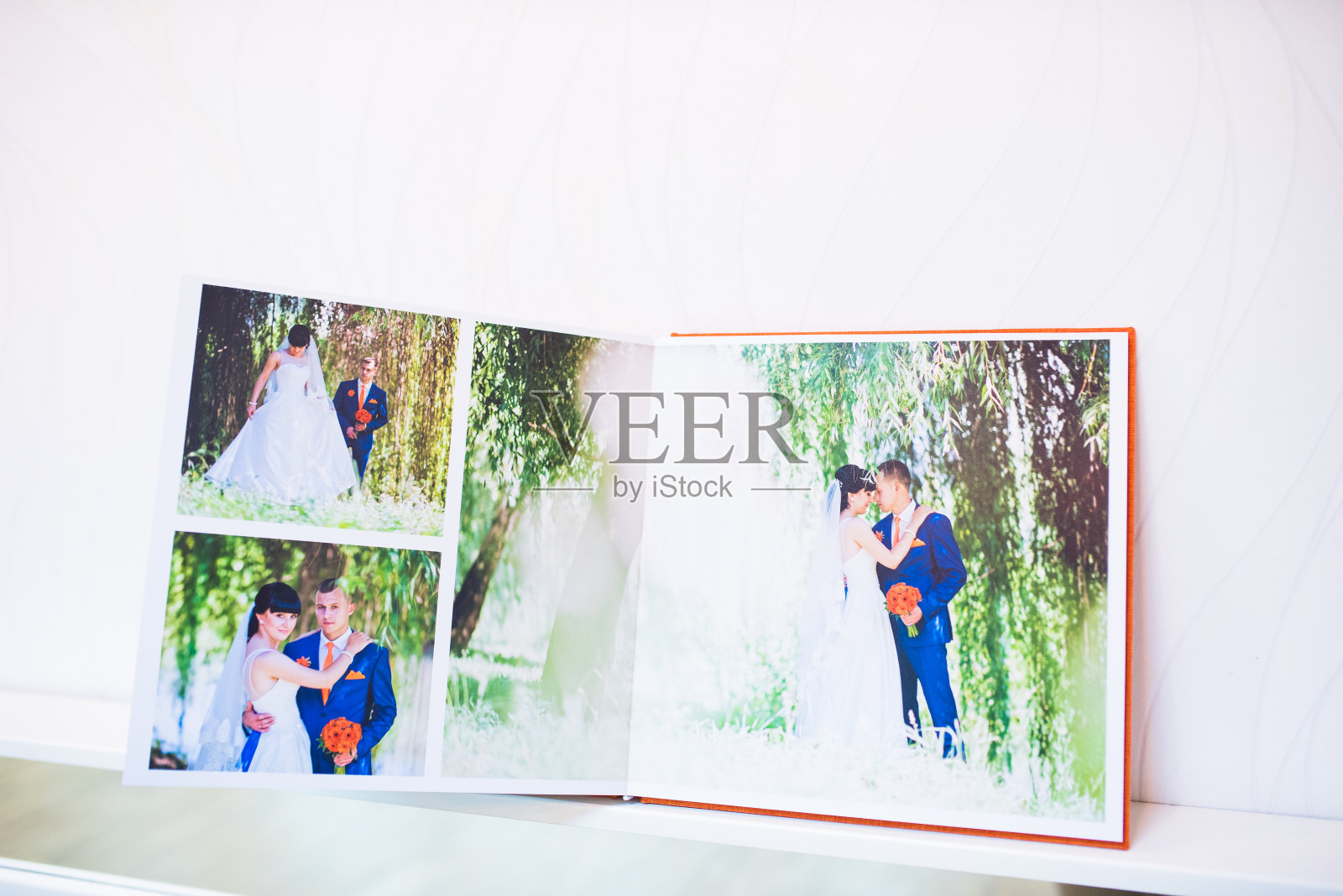 蓝色和橙色的纺织婚纱照和相册照片摄影图片