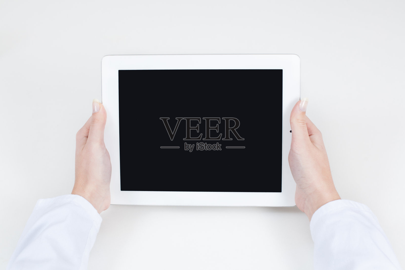 医生拿着一个自由文本空间的平板电脑照片摄影图片