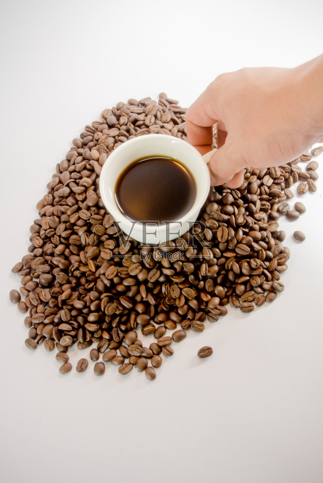 手捧着一杯咖啡照片摄影图片