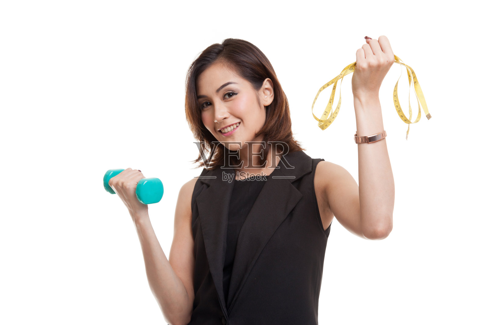 健康的亚洲女人拿着哑铃和卷尺。照片摄影图片