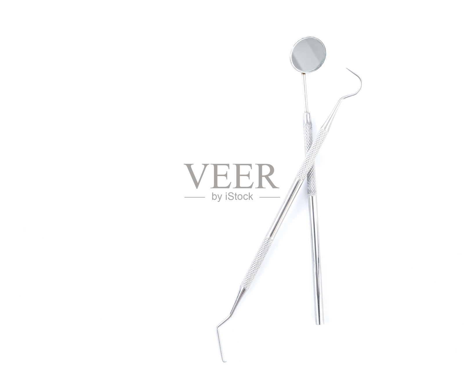 白色背景上的牙科工具照片摄影图片