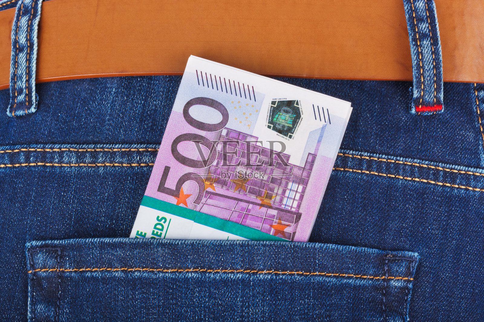 牛仔裤口袋里的钱照片摄影图片