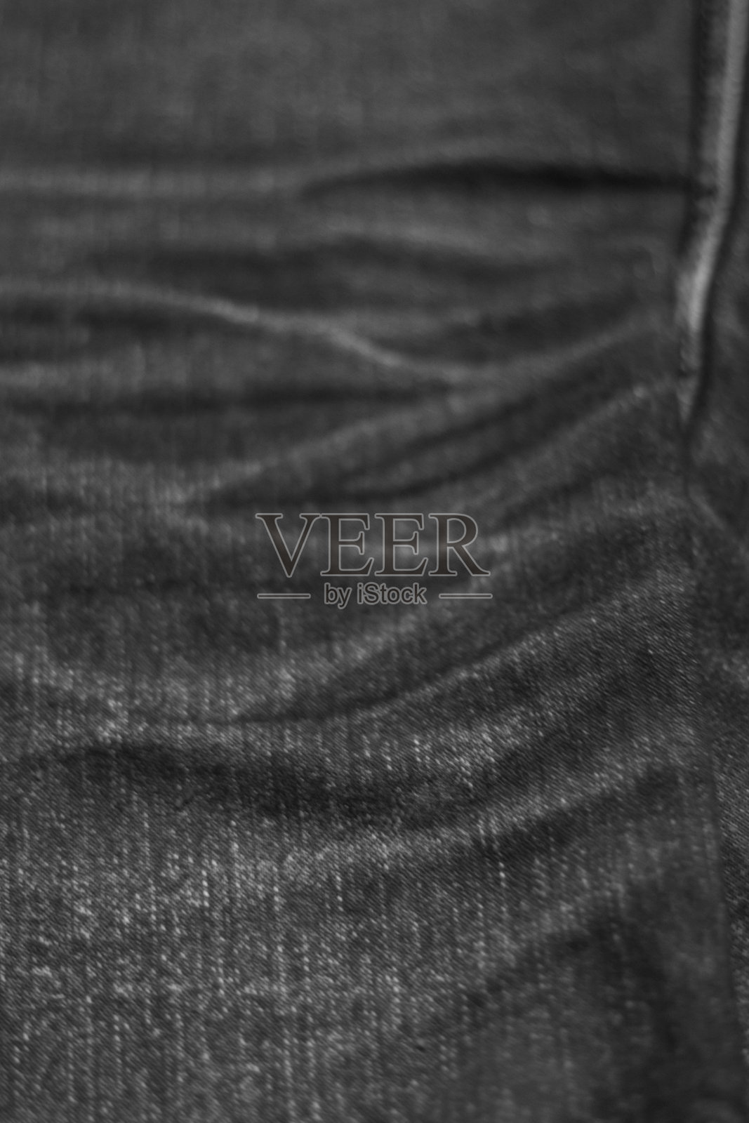 纹理背景的牛仔裤软焦点，背面模糊照片摄影图片