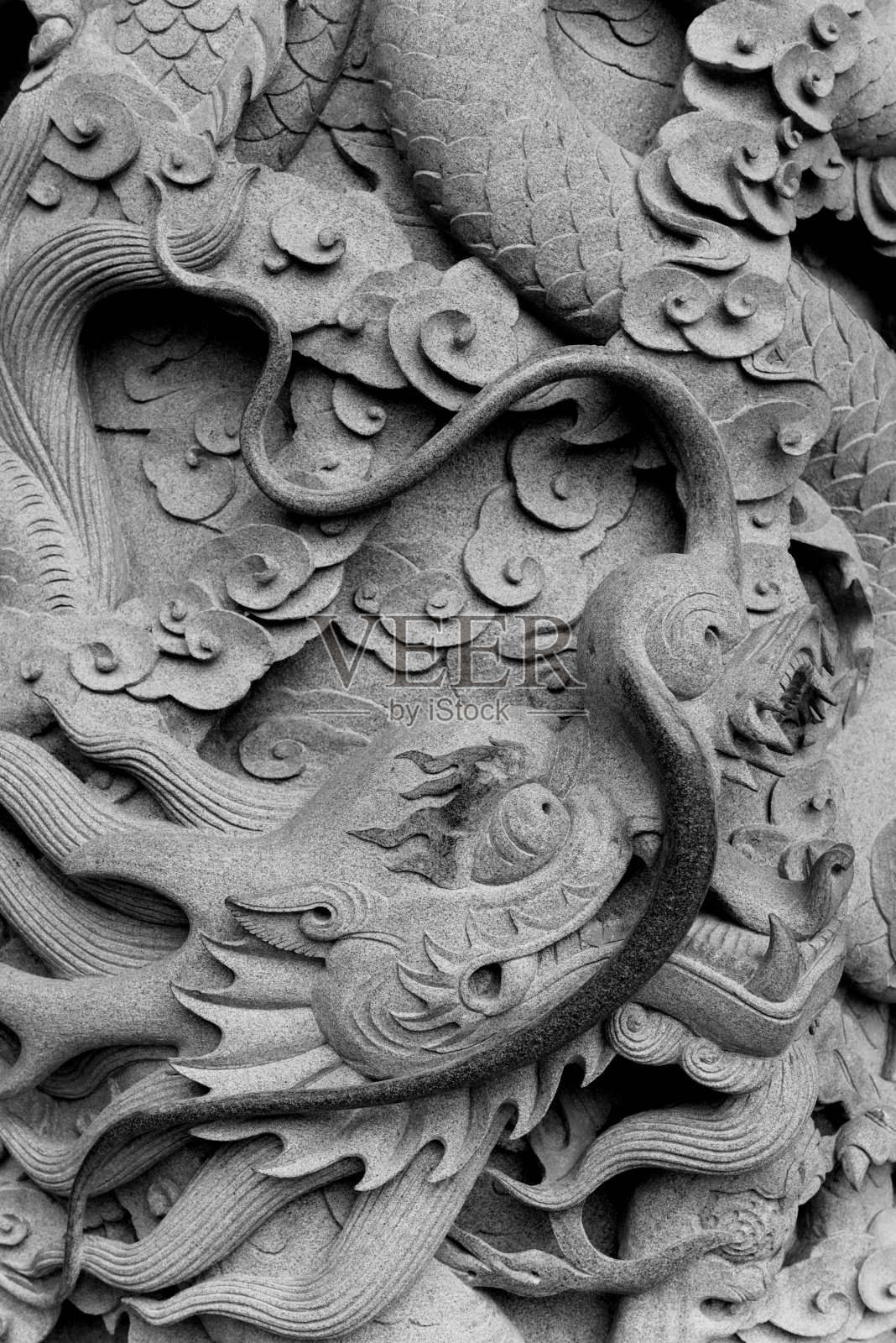 龙低bas雕塑在墙上照片摄影图片