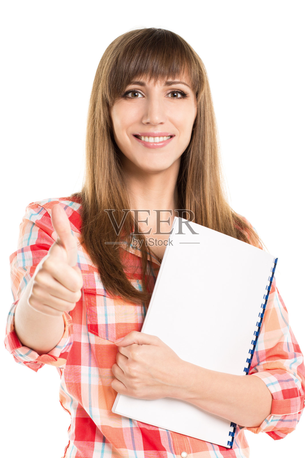 年轻漂亮的女人拿着空白的笔记本竖起大拇指照片摄影图片