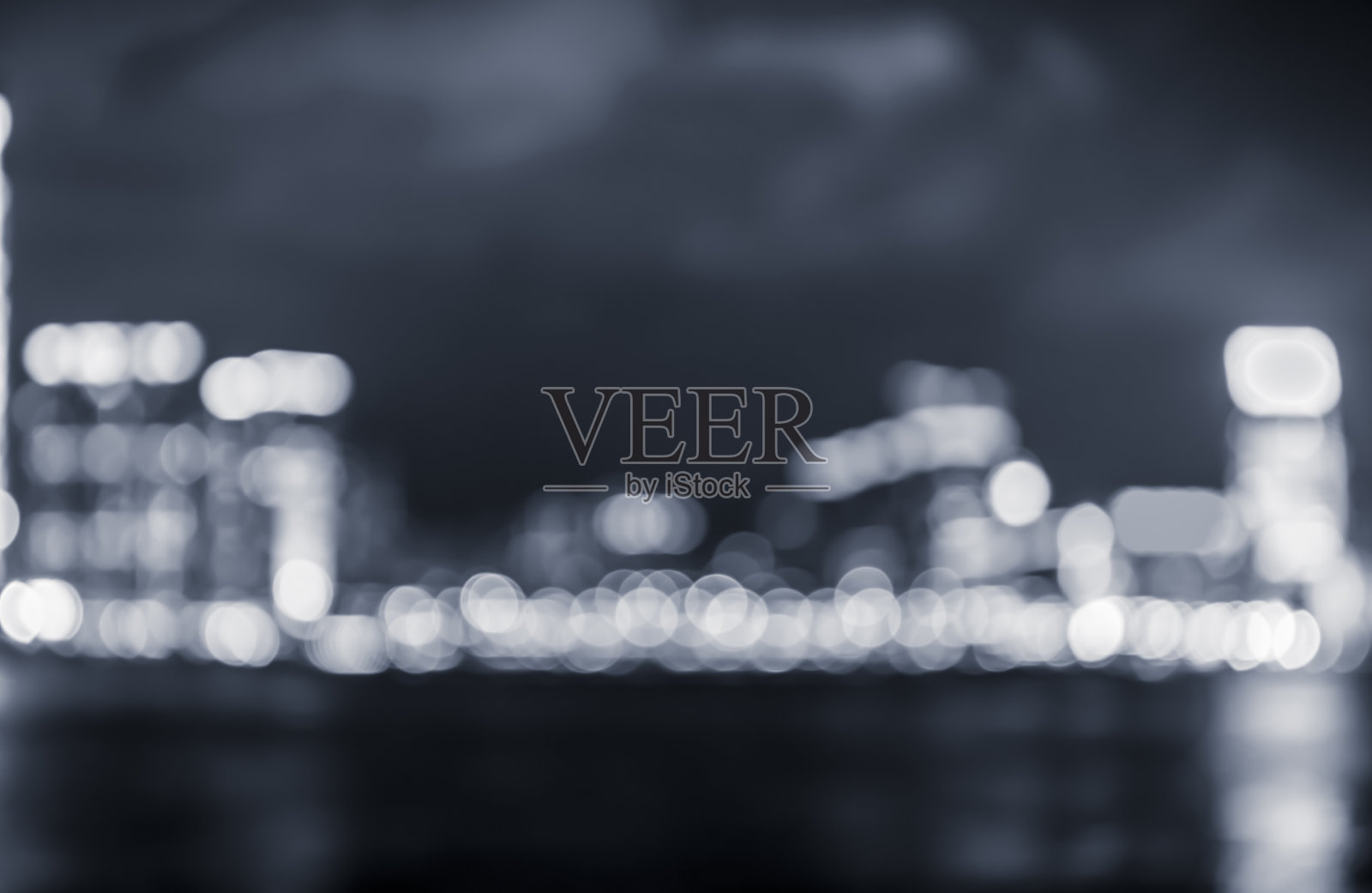 抽象的散景城市灯光为背景，香港以蓝色为主色调照片摄影图片