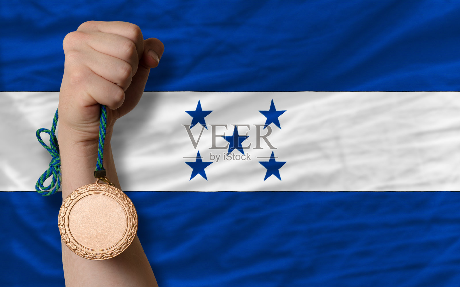 运动铜牌和洪都拉斯国旗照片摄影图片