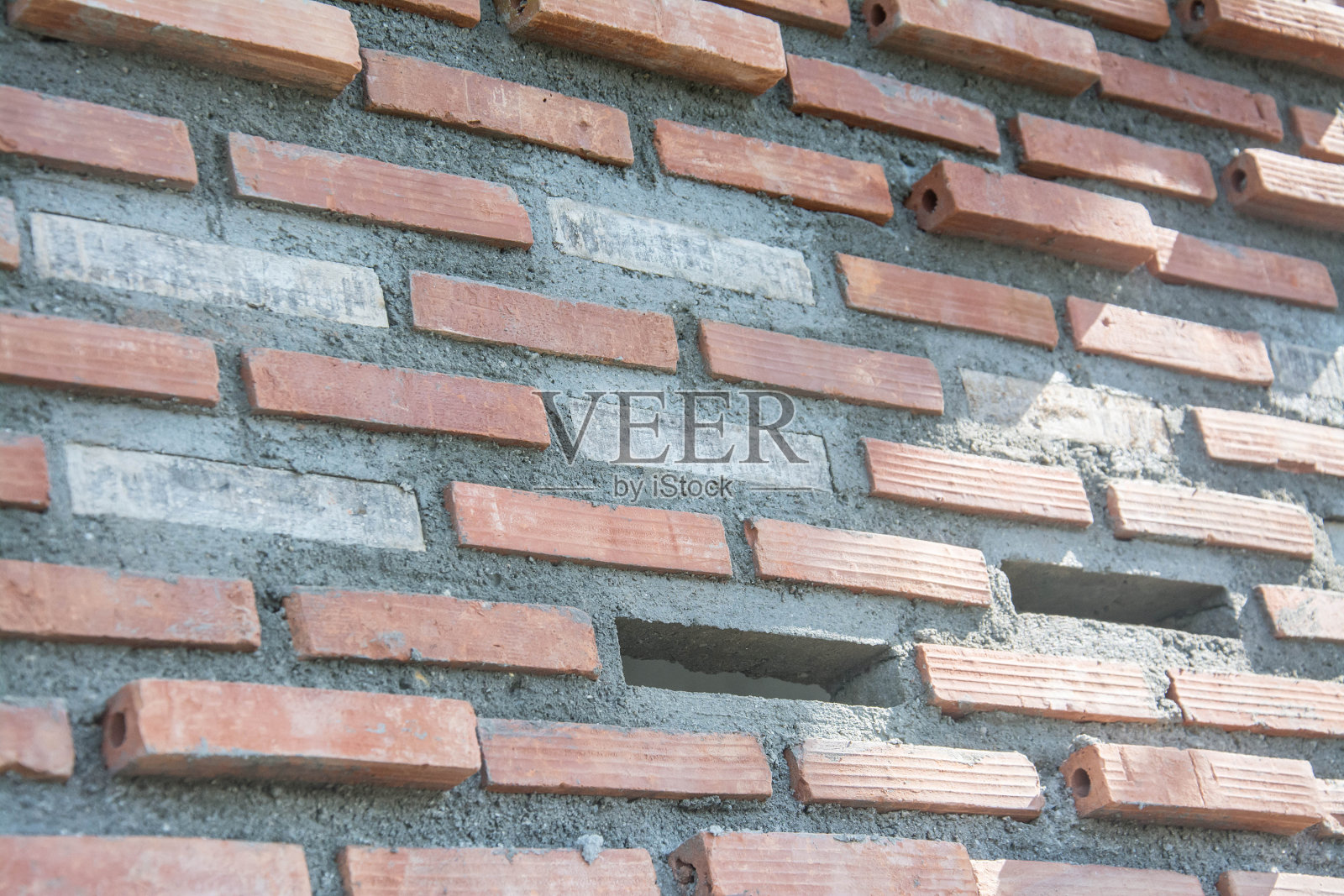 红色旧砖墙背景上的空隙照片摄影图片